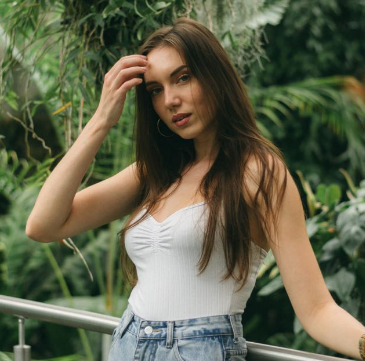 Alexandra posing with nature view behind
