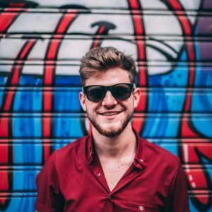 Mircea Posing on a wall with grafitti