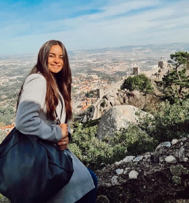 Nicole with a rock landscape behind.